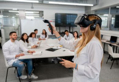 A student uses virtual reality headset in the classroom