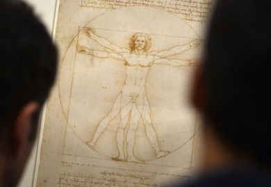People look at the "Vitruvian Man" a drawing by Leonardo da Vinci, illustrating the combination of arts and science People look at the "Vitruvian Man" a drawing by Leonardo da Vinci, illustrating the combination of arts and science