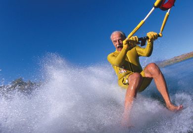 Older man waterskis