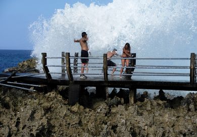 People splashed with big wave