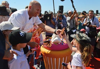Celebrity chief Matt Moran cuts pieces of a giant cake of the Sydney Opera House as the world heritage-listed building celebrates its 40th birthday on October 20, 2013