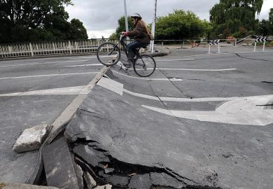 Tania Flowers rides her bike onto a damaged bridge over the Avon River  Tania Flowers rides her bike onto a damaged bridge over the Avon River to illustrate New Zealand scraps research reforms and infrastructure funding