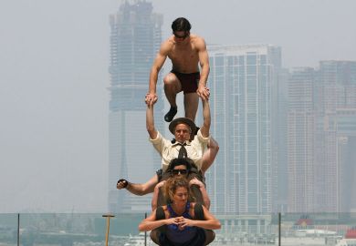 Circus Oz from Australia try to balance on each other Circus Oz from Australia try to balance on each other to illustrate Overseas earnings do not balance books, Australian v-cs say