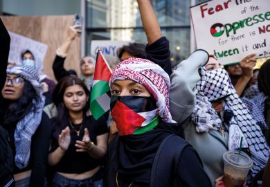 Students from Hunter College chant and hold up signs during a pro-Palestinian demonstration at the entrance of their campus. Students from Hunter College chant and hold up signs during a pro-Palestinian demonstration at the entrance of their campus to illustrate Israeli war revives academic freedom turmoil on US campuses