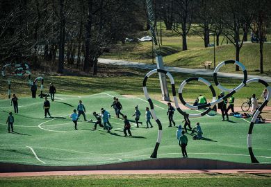 Children play on The 'Puckelboll' pitch, a distorted artificial grass pitch for football, where the pitch halves and objectives are of different sizes and where the artificial turf is bumpy,  to illustrate Swedish funding overhaul devalues basic research