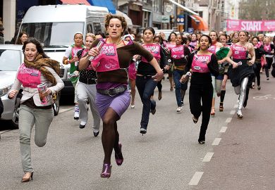 Women run down Amsterdam's most famed fashion street in stiletto heels to illustrate Dutch universities blocked from using gender quotas in admissions