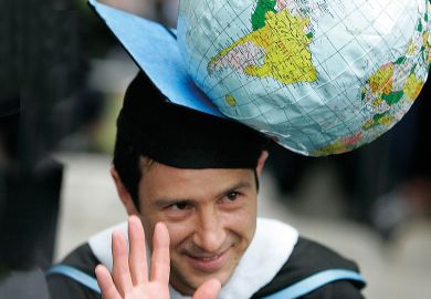 Justin Ginnetti, a graduate of the Fletcher School of Law and Diplomacy, wearing n inflatable globe hat to illustrate Supercharge the goals