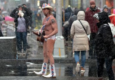 Street performer Naked Cowboy walks through the snow on Time Square Street performer Naked Cowboy walks through the snow on Time Square to illustrate Open science funding cuts leave us ‘unprepared’ for next pandemic