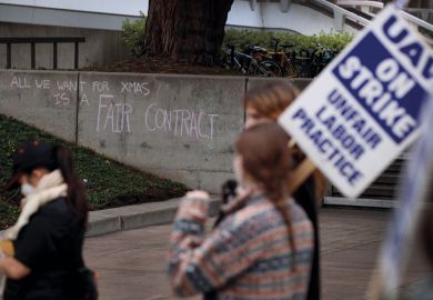A message is written on a wall as University of California picketers protest at University of California to illustrate California ‘reclassifies workers to duck pay rises’ won in strike