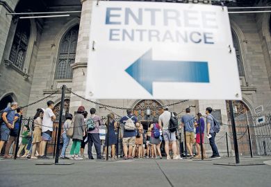 Tourists wait in line outside the Notre-Dame Basilica in Montreal, Quebec, Canada Tourists wait in line outside the Notre-Dame Basilica in Montreal, Quebec, Canada to illustrate Universities blindsided as Quebec set to double non-
