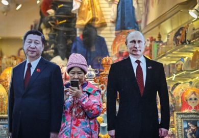 A tourist stands next to cardboard images depicting Chinese President Xi Jinping (L) and his Russian counterpart Vladimir Putin at the touristic Arbat street in downtown Moscow A tourist stands next to cardboard images depicting Chinese President Xi Jinping (L) and his Russian counterpart Vladimir Putin at the touristic Arbat street in downtown Moscow to illustrate Russian research is ‘increasingly isolated’ by Ukraine conflict