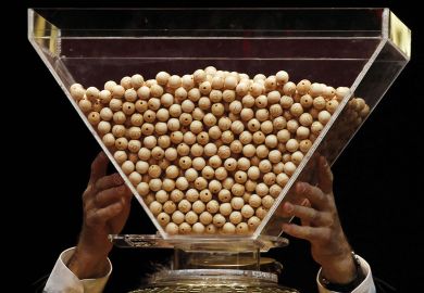 Lottery balls are dropped into a rotating drum before the start Lottery balls are dropped into a rotating drum before the start to illustrate Netherlands plots cautious return to degree admission lotteries