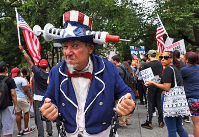 Person dressed as Uncle Sam with Vaccine American hat Person dressed as Uncle Sam with Vaccine American hat as metaphor for US partisan divide over Covid splitting apart campuses