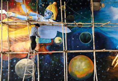 An artist gives final touches to a mural painted under a bridge in New Delhi to illustrate High hopes, low expectations for India’s ‘dream’ research funder