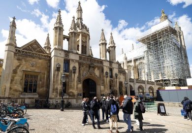 A tour guide speaks to tourists outside the entrance to King's College, University of Cambridge, in Cambridge to illustrate Cambridge growth plan ‘backs up UK science superpower vision’