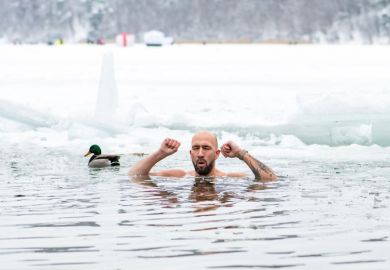 man ice bathing in the freezing cold water of a frozen lake among ducks to illustrate Norwegian universities brace for ‘entirely new economic reality’
