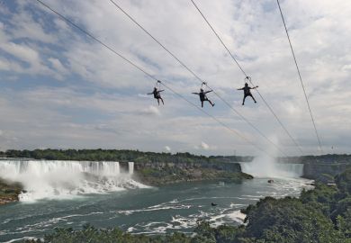 People ride a zip line on the Canadian side of the Niagara River People ride a zip line on the Canadian side of the Niagara River to illustrate Canada ‘may fall short of caps’ as overseas interest nosedives