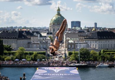 Person dives from the 28 metre platform at the Copenhagen Opera House. Person dives from the 28 metre platform at the Copenhagen Opera House. to illustrate regions hit hardest as Danish applications drop 11 per cent