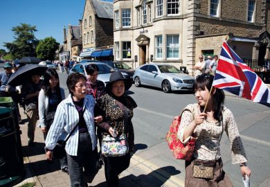 Chinese tourists take a guided tour at Bourton-on-the-Water UK to illustrate Chinese students ‘prefer UK to other study destinations’