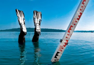 Divers feet and a measure stick showing above water level only Divers feet and a measure stick showing above water level only as a metaphor for Journal impact factor ban is bad for Dutch science