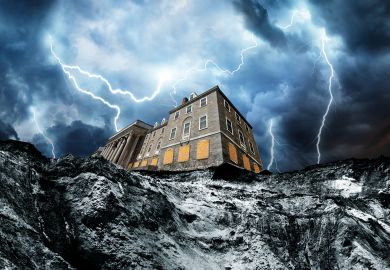 A house partially hangs over a cliff edge following rapid coastal erosion with lightening A house partially hangs over a cliff edge following rapid coastal erosion with lightening to illustrate What would happen if a  UK university went bankrupt?
