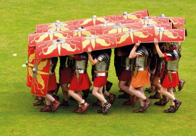 Ermine Street Guard demonstrate the tortoise defensive manoeuvre in display of fighting skills to illustrate OfS accused of lack of transparency over 30 standards probes