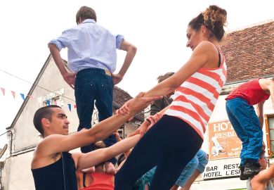 Street performers practice their routine to illustrate French research reforms ‘must tackle distrust’ to succeed