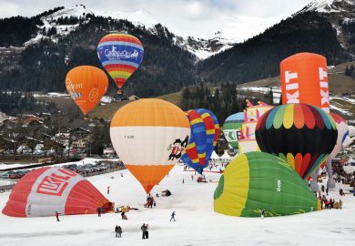 Hot air balloons take off in the Swiss Alps Hot air balloons take off in the Swiss Alps to illustrate Squeezed Swiss weigh EU alliances against global mobility