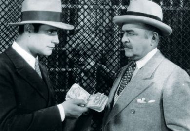 Victor Varconi (1896-1976) handing money to a man in a scene from the film 'Chicago' Victor Varconi (1896-1976) handing money to the lawyer in a scene from the film 'Chicago' as a metaphor for Sheffield ‘turned down £10 milllion’ for apprenticeships