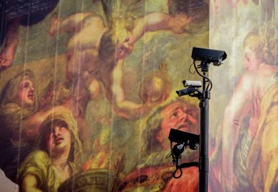 Surveillance cameras keep watch in front of a giant hoarding with classical figures in the background to illustrate report says digital surveillance of scholars ‘erodes faculty freedom’