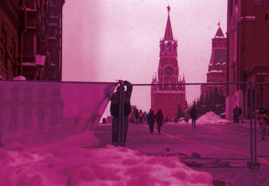 Workers set up a fence at the Red Square to illustrate West should not abandon all Russian scholars