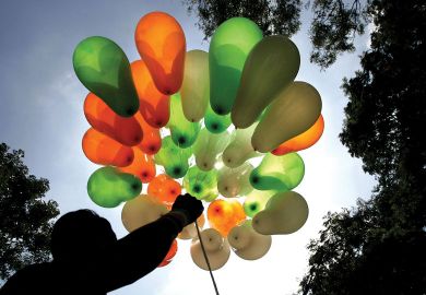 A vendor displays his stock of balloons in the tri-colours of the national flag on a street in Bangalore. A vendor displays his stock of balloons in the tri-colours of the national flag on a street in Bangalore.