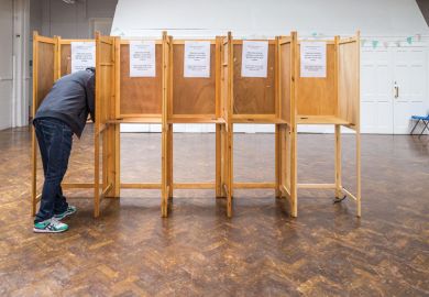 One person in empty line of voting booths to illustrate UK scholars’ strike fatigue leaves union facing uncertain path