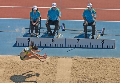 Australia's Lisa Morrison competes in the Women's Long Jump with a measure stick next to her to illustrate Don’t scale back research quality criteria, Australian universities say
