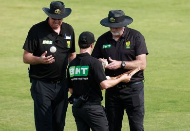 The umpires choose another ball at Lavington Sports Ground, Australia The umpires choose another ball at Lavington Sports Ground, Australia to illustrate Don’t pick sides in superpower rivalry, universities warned
