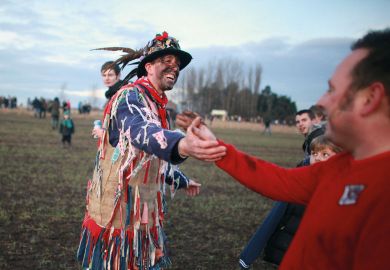 Two people shake hands Two people shake hands to illustrate Late reprieve allows scientists with UK grants to publish in Nature