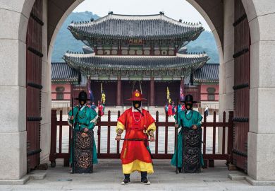 Guards of Gyeongbokgung stand at the closed gates of the palace to illustrate Korean universities hit with overseas recruitment bans