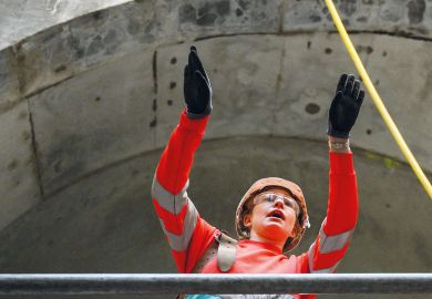 Civil engineer working on a wide concrete tunnel to illustrate Raac closures and disruption ‘worst case scenario’ as term begins