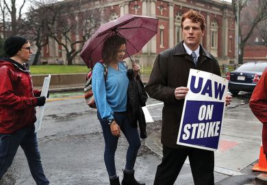 U.S. Representative Joe Kennedy lll walks the picket line with Harvard University graduate students to illustrate US colleges hit by wave of student labour unionization