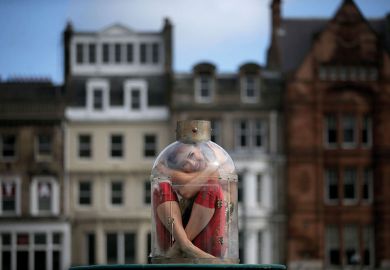  Contortionist Odka, from Cirque Berserk, sitting in a tiny bottle to illustrate ‘Pod-sized’ rooms plan to reduce UK student rents