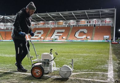 Ground staff paints the white lines of the football pitch in Blackpool to illustrate What can academics and universities learn from Jo Phoenix’s employment tribunal victory