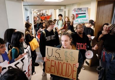 Students at University of Massachusetts Amherst stage a sit in and present their demands to the Chancellor to end what they called, "UMass Amherst's ties with war profiteers and call for a ceasefire