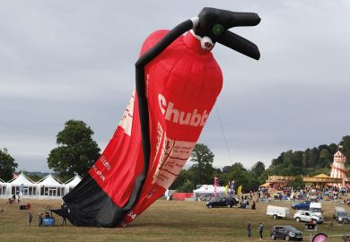 Balloon of a  fire extinguisher deflating at the Bristol International Balloon Fiesta to illustrate Top departments face cuts under ‘unnoticed’ REF funding shift