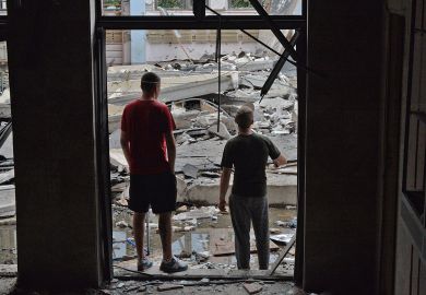 Workers inspect the damage after a Russian missile hits the National Technical University in Kharkiv, Ukraine Workers inspect the damage after a Russian missile hits the National Technical University in Kharkiv, Ukraine to illustrate Ukrainian staff report high anxiety and little institutional help