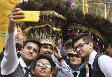 Students taking a photo during a press preview of the 30th International Surajkund Art Crafts Mela at Surajkund to illustrate Indian states blacklisted as Australian visa rejections soar