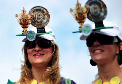Tennis fans wear hats featuring the cups during the Wimbledon Tennis Championships Tennis fans wear hats featuring the cups during the Wimbledon Tennis Championships to illustrate Royal Society offers publishing discounts for peer reviewers