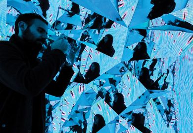 SYDNEY, AUSTRALIA - JUNE 06: A couple taking photos in an installation in the Samsung Galaxy Studio SYDNEY, AUSTRALIA - JUNE 06: A couple taking photos in an installation in the Samsung Galaxy Studio