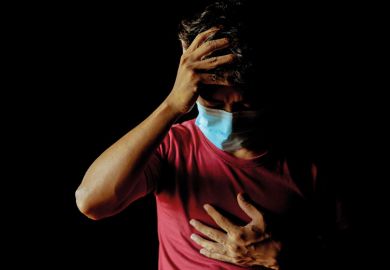 Asian man wearing a mask has a headache and has difficulty breathing after contracting Covid-19 even after undergoing treatment. to illustrate long Covid