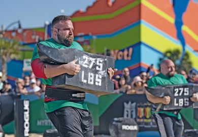 A participant competes in the World's Strongest Man competition to illustrate Fafsa: short-term pain on enrolments, but hope of long-term gain
