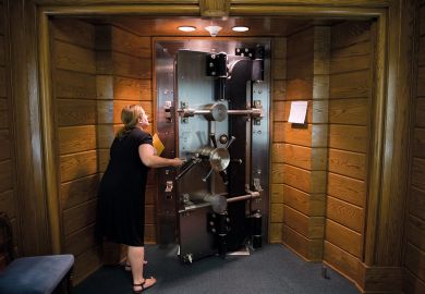 Person opens the library's vault located in the basement of the Folger Shakespeare Library, Washington Person opens the library's vault located in the basement of the Folger Shakespeare Library, Washington to illustrate US universities protest against research fraud transparency rules